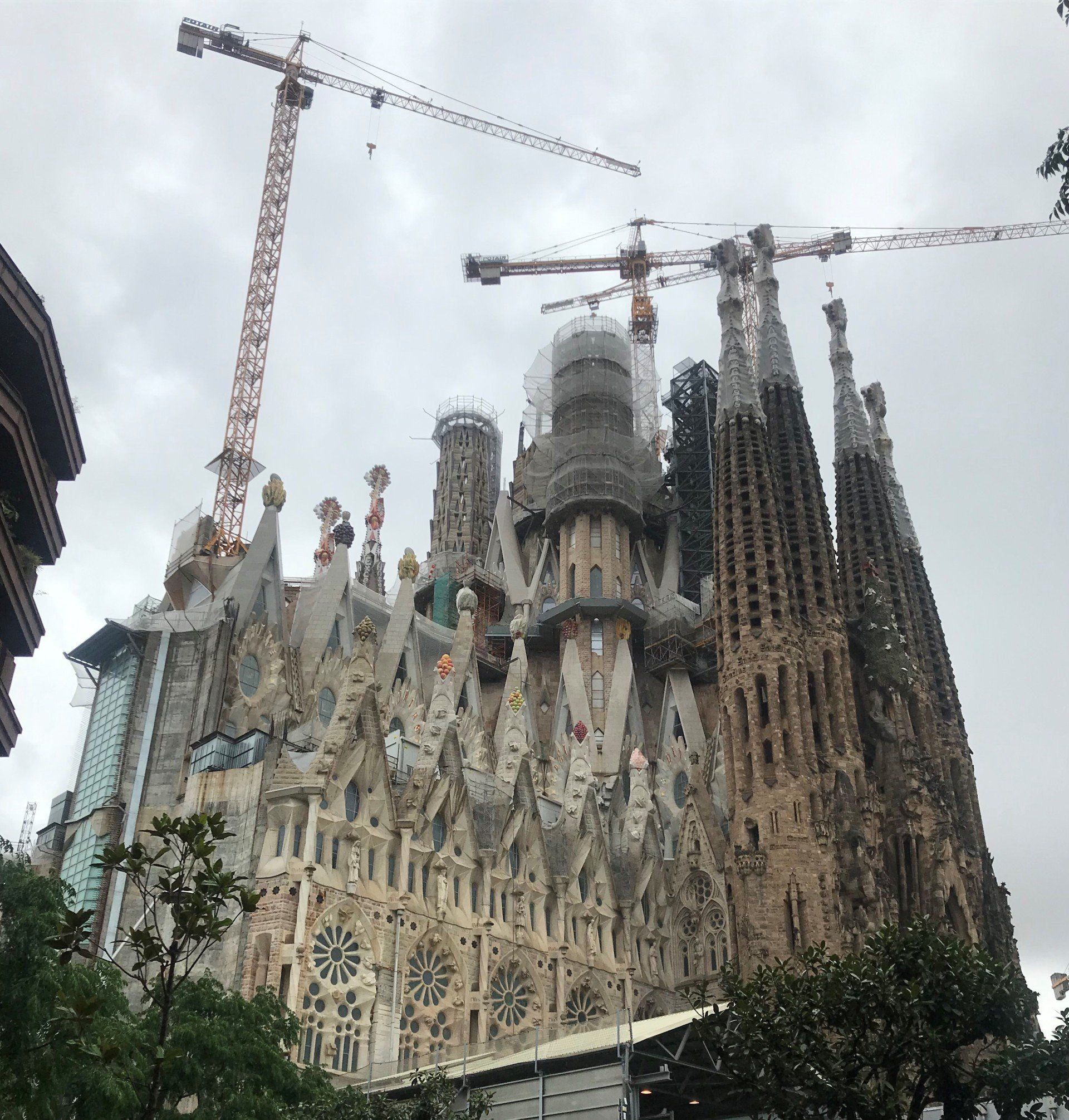 A large building with a crane on top of it