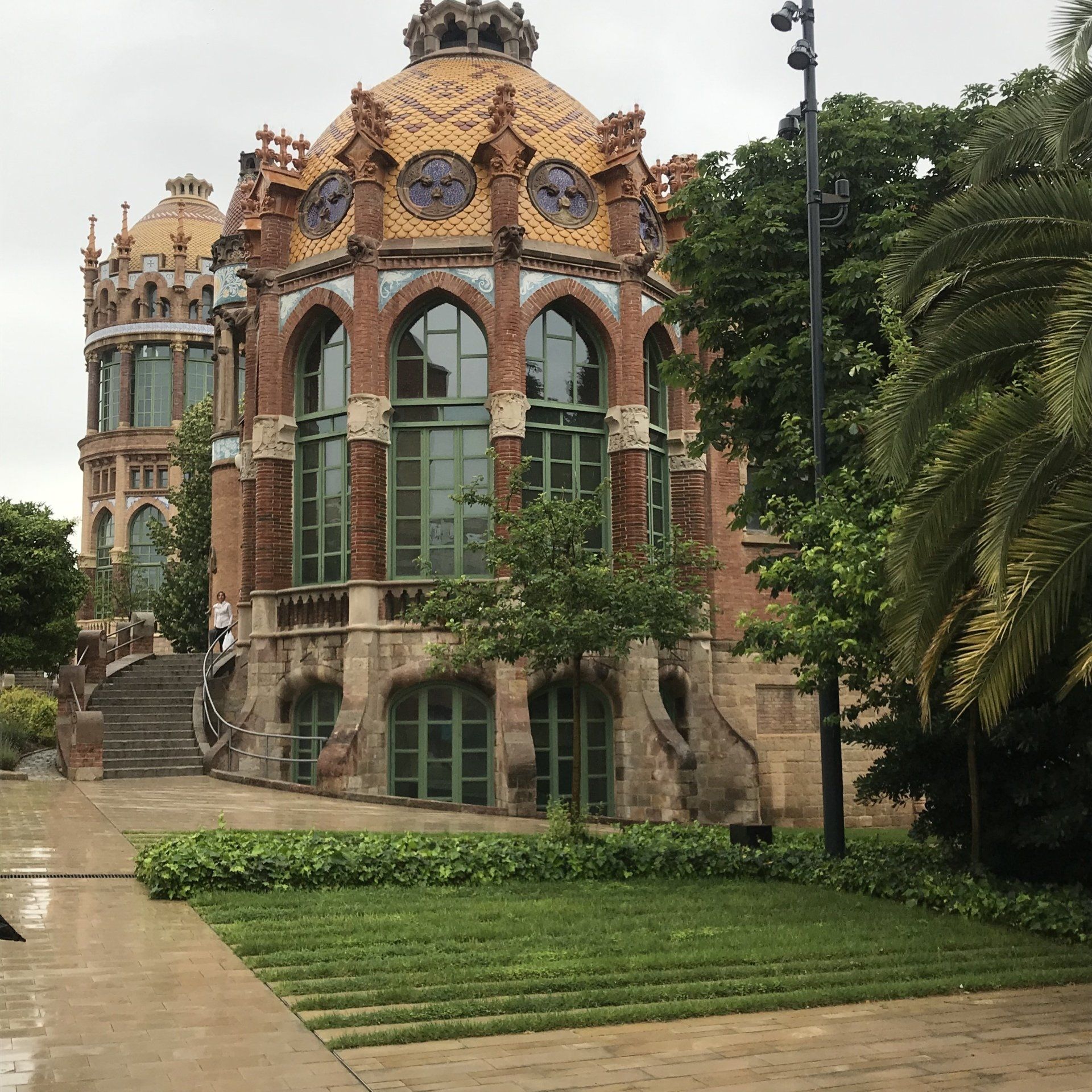 A large brick building with a dome on top of it
