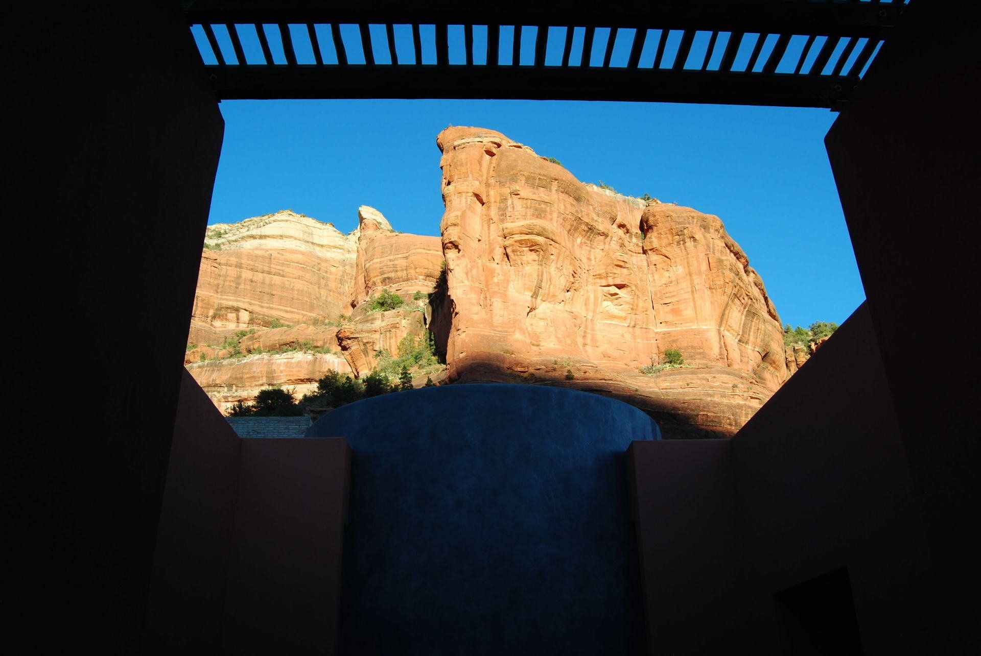 A view of a waterfall from inside a building