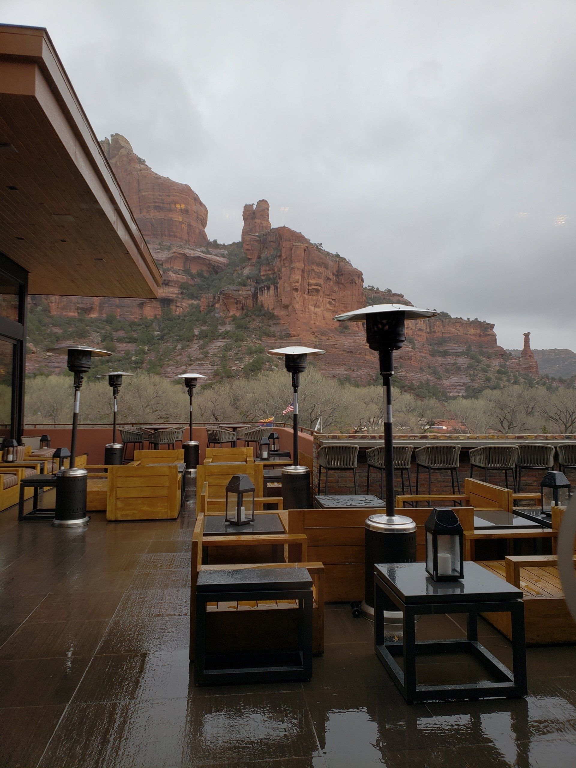 A patio area with a mountain in the background