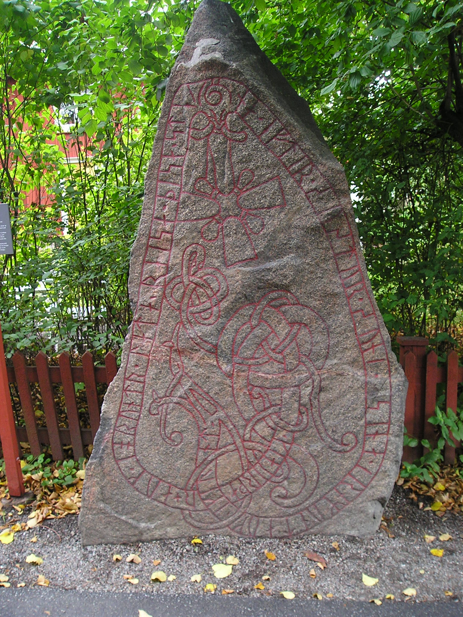 A large stone with a drawing of a dragon on it