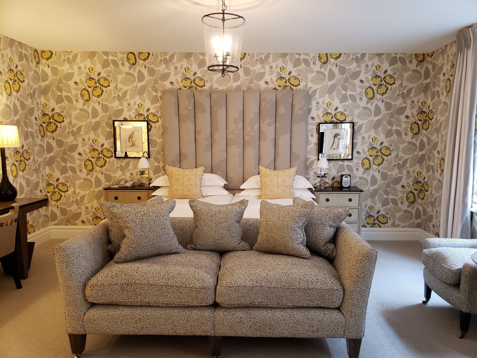 A bedroom with a couch and a bed in it