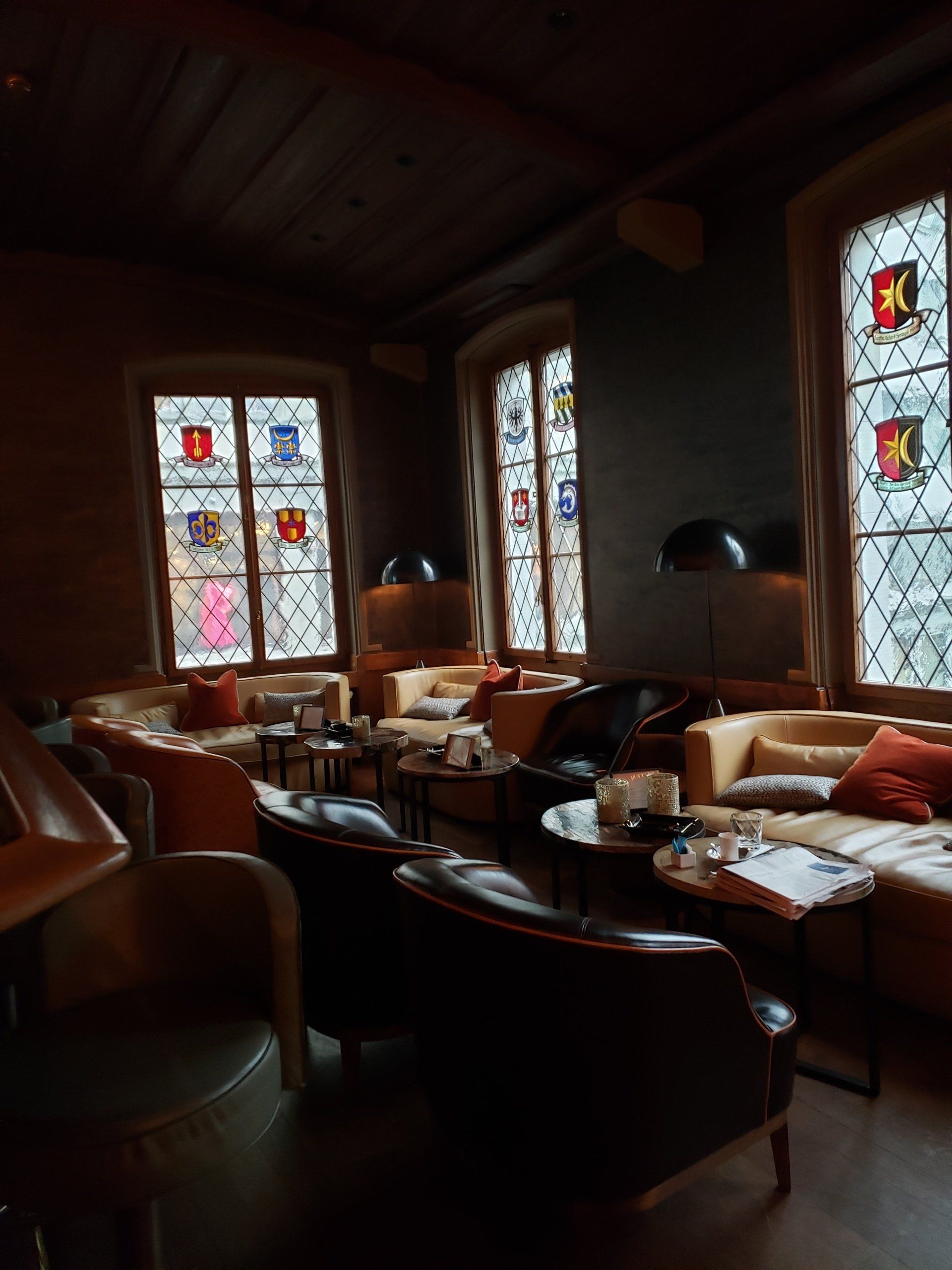 A room with a lot of furniture and stained glass windows