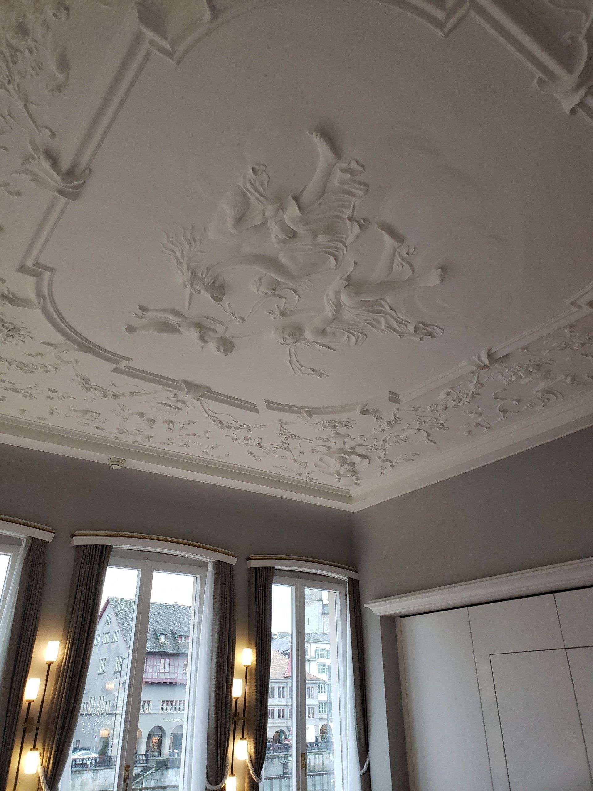 A room with a ceiling and a lot of windows