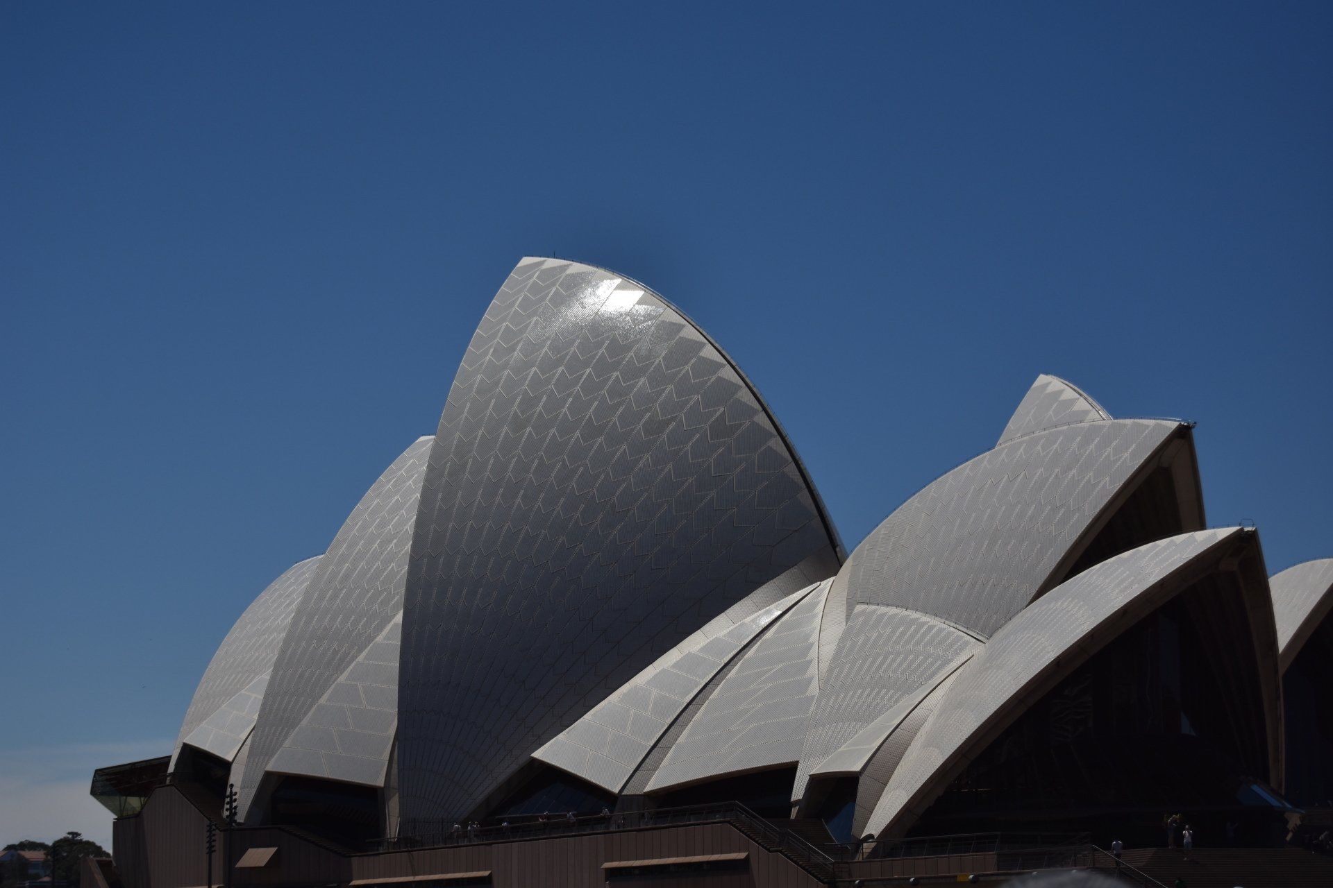 A large white building with a blue sky in the background