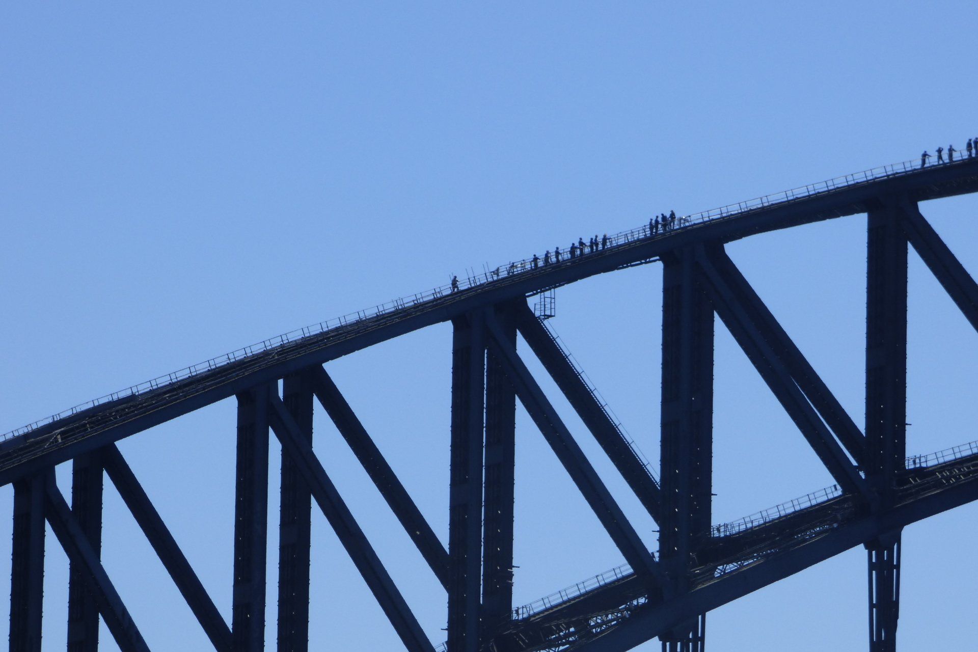 A bridge with a blue sky in the background