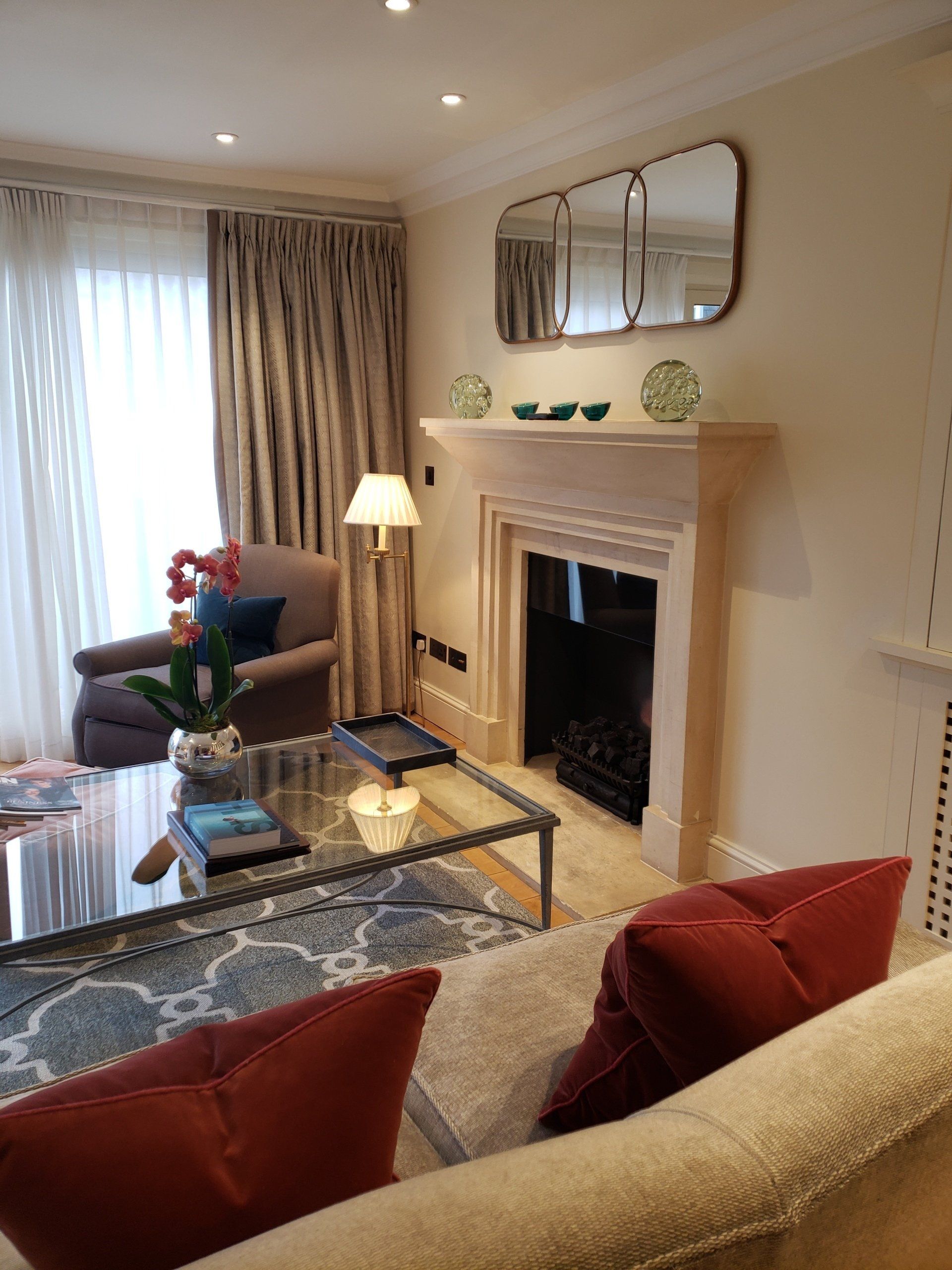 A living room with a fireplace and a couch