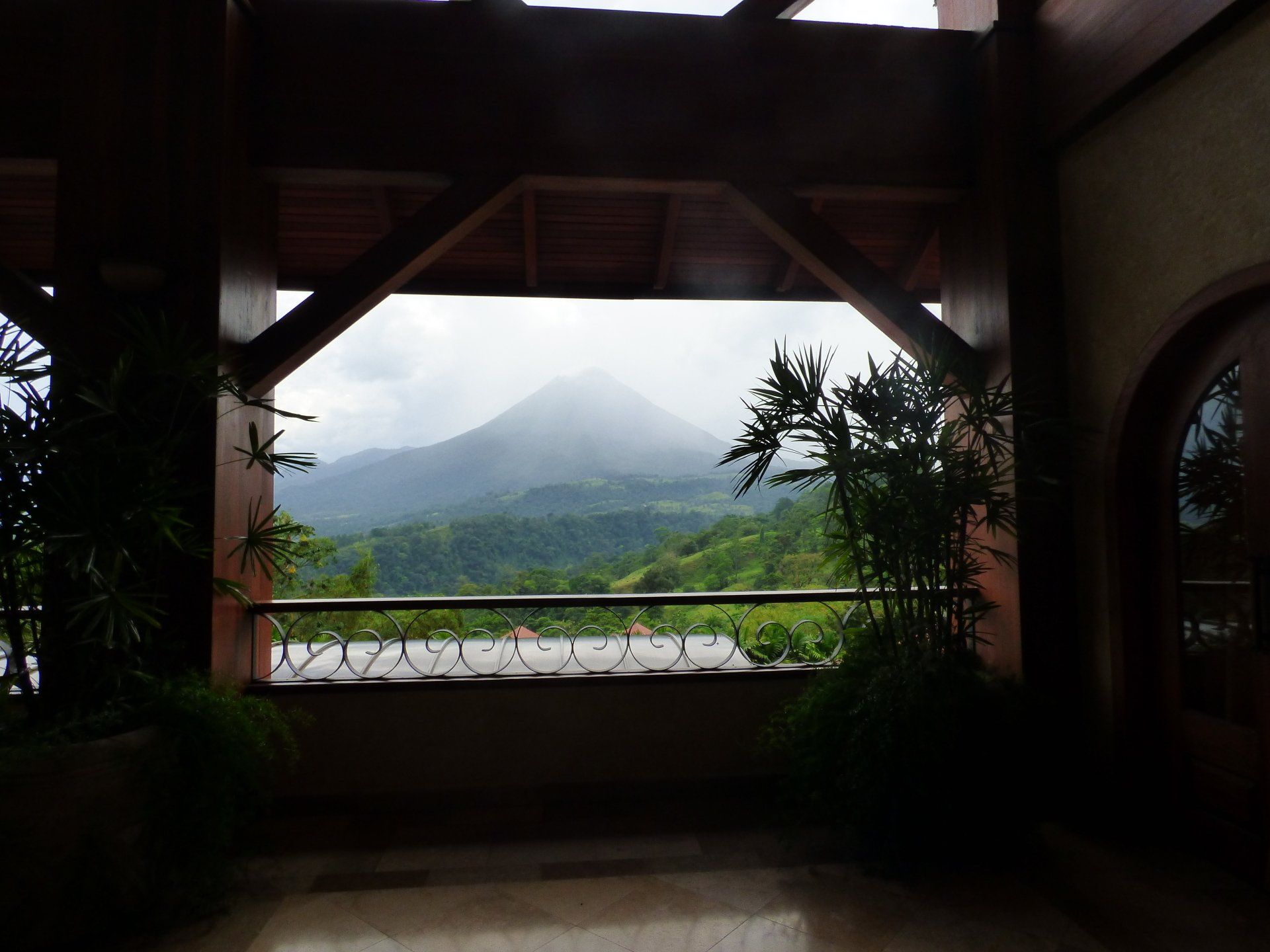 A balcony with a view of a mountain in the background