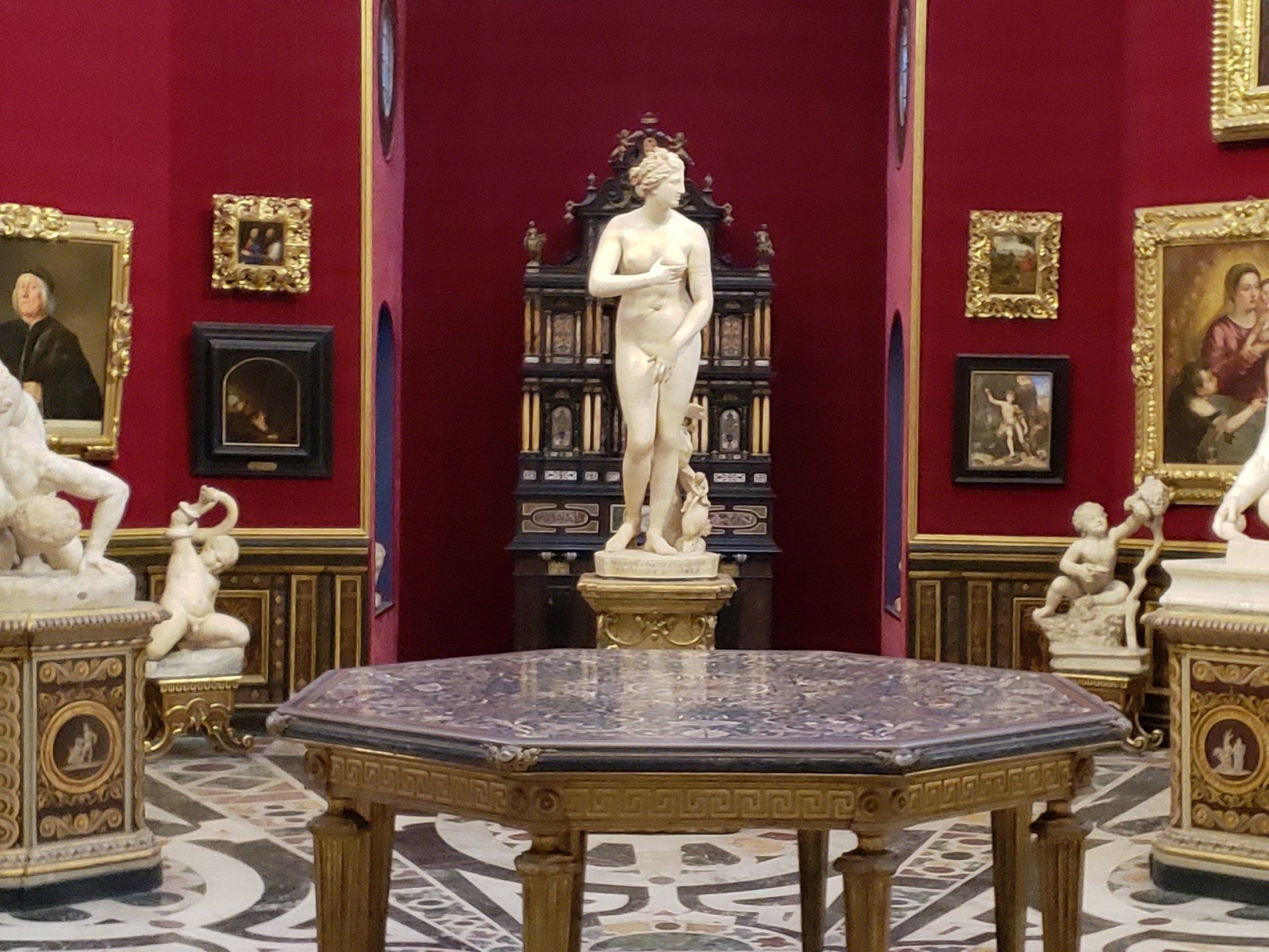 A statue of a woman is on display in a museum