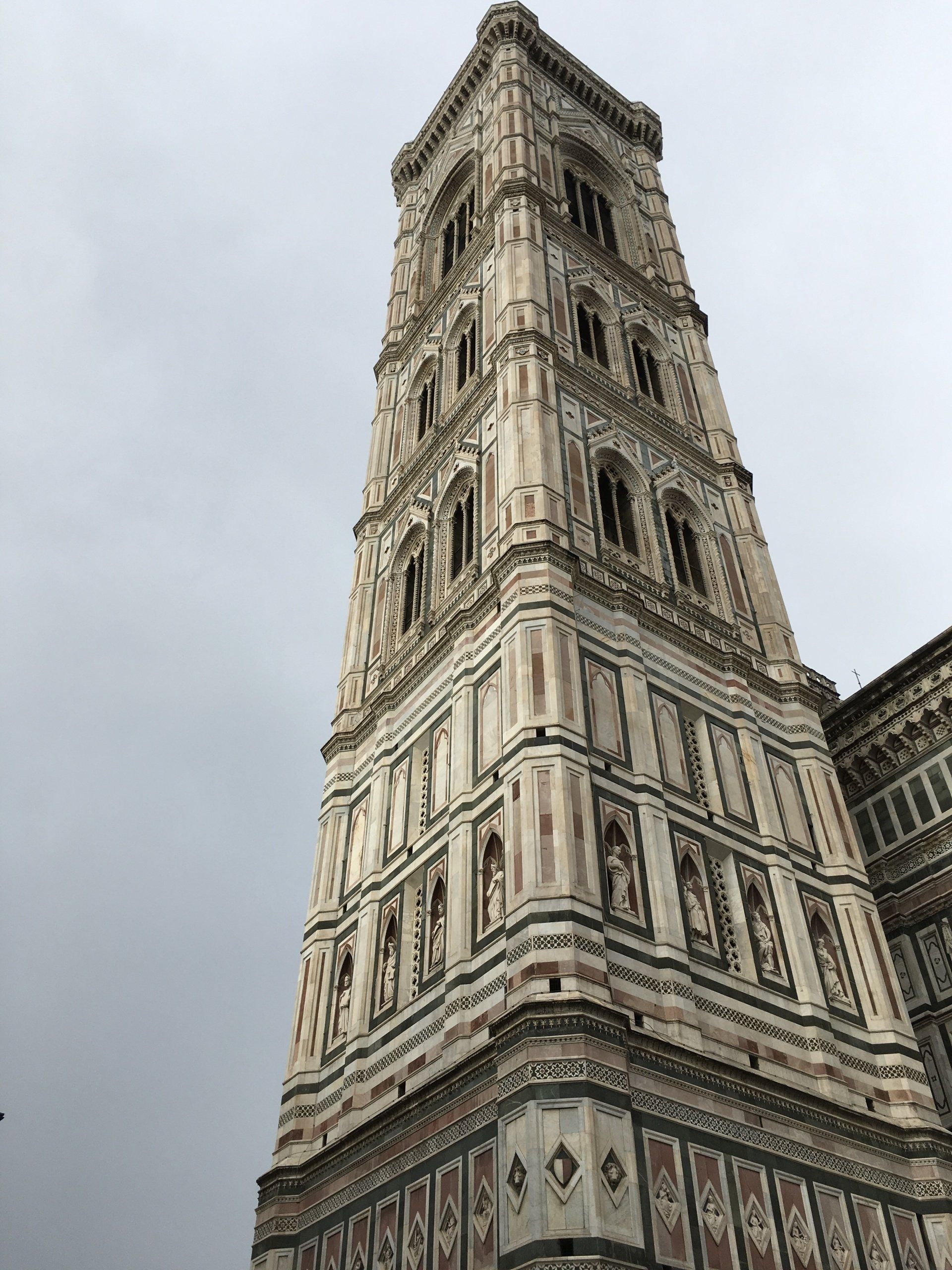 A very tall building with a bell tower on top of it.