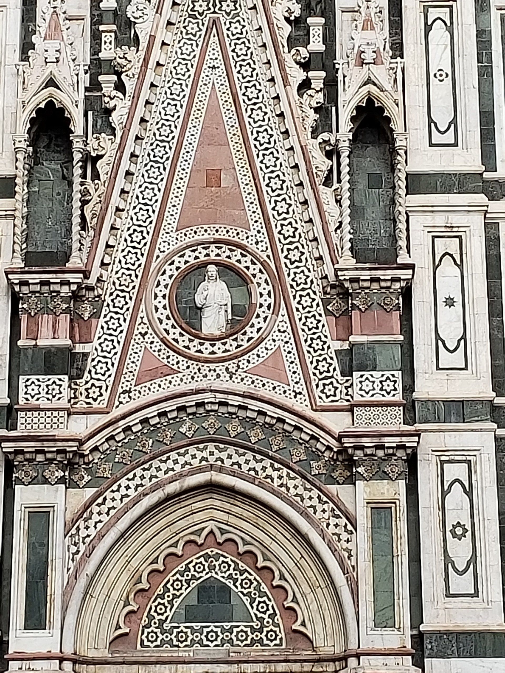 A large building with a clock on the front of it.