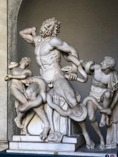 A statue of a man with a snake around his neck