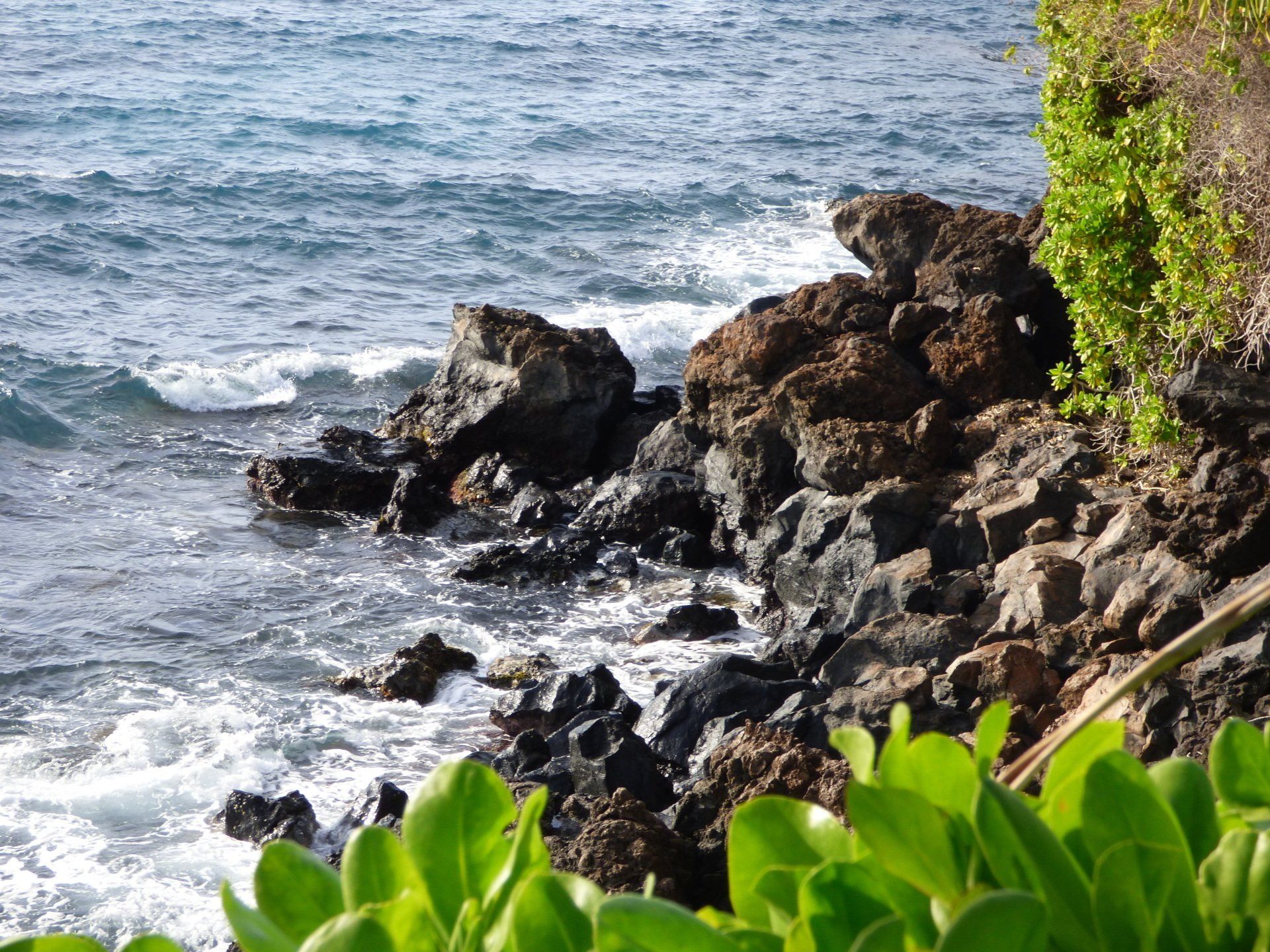 A rocky shoreline with waves crashing on the rocks