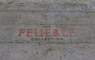 The feuerle collection is written in red on a concrete surface.