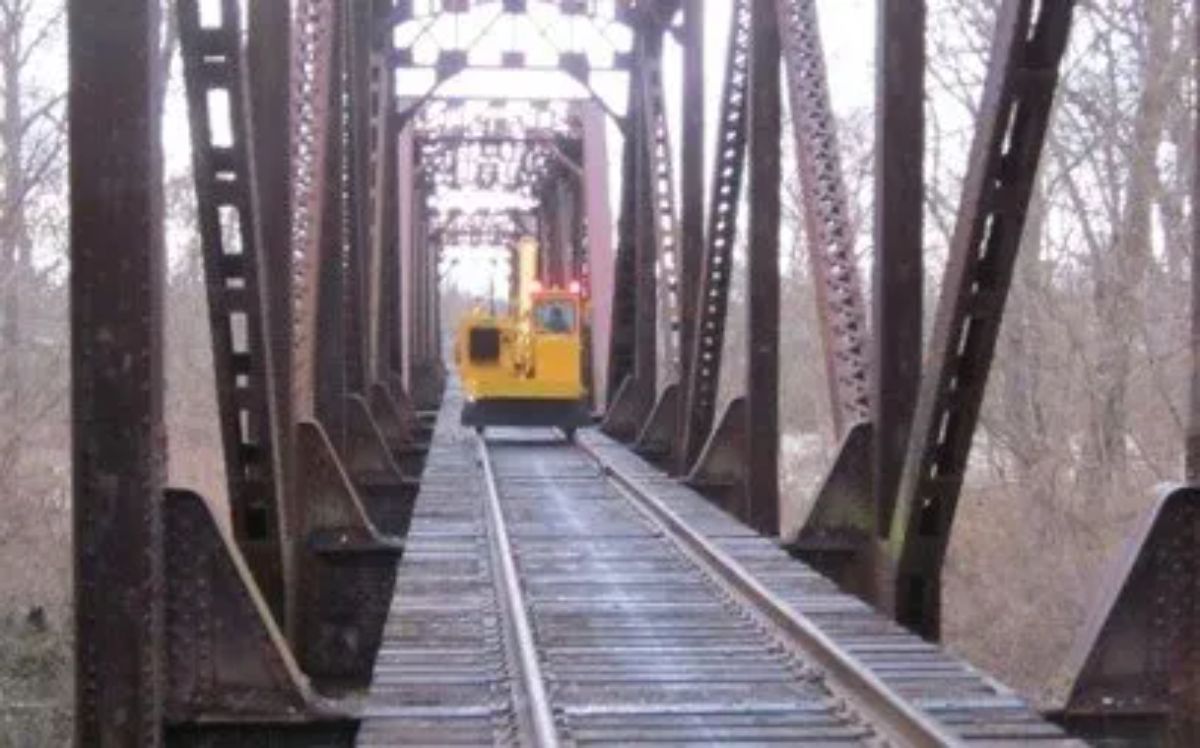 track vehicle on enclosed rail bridge