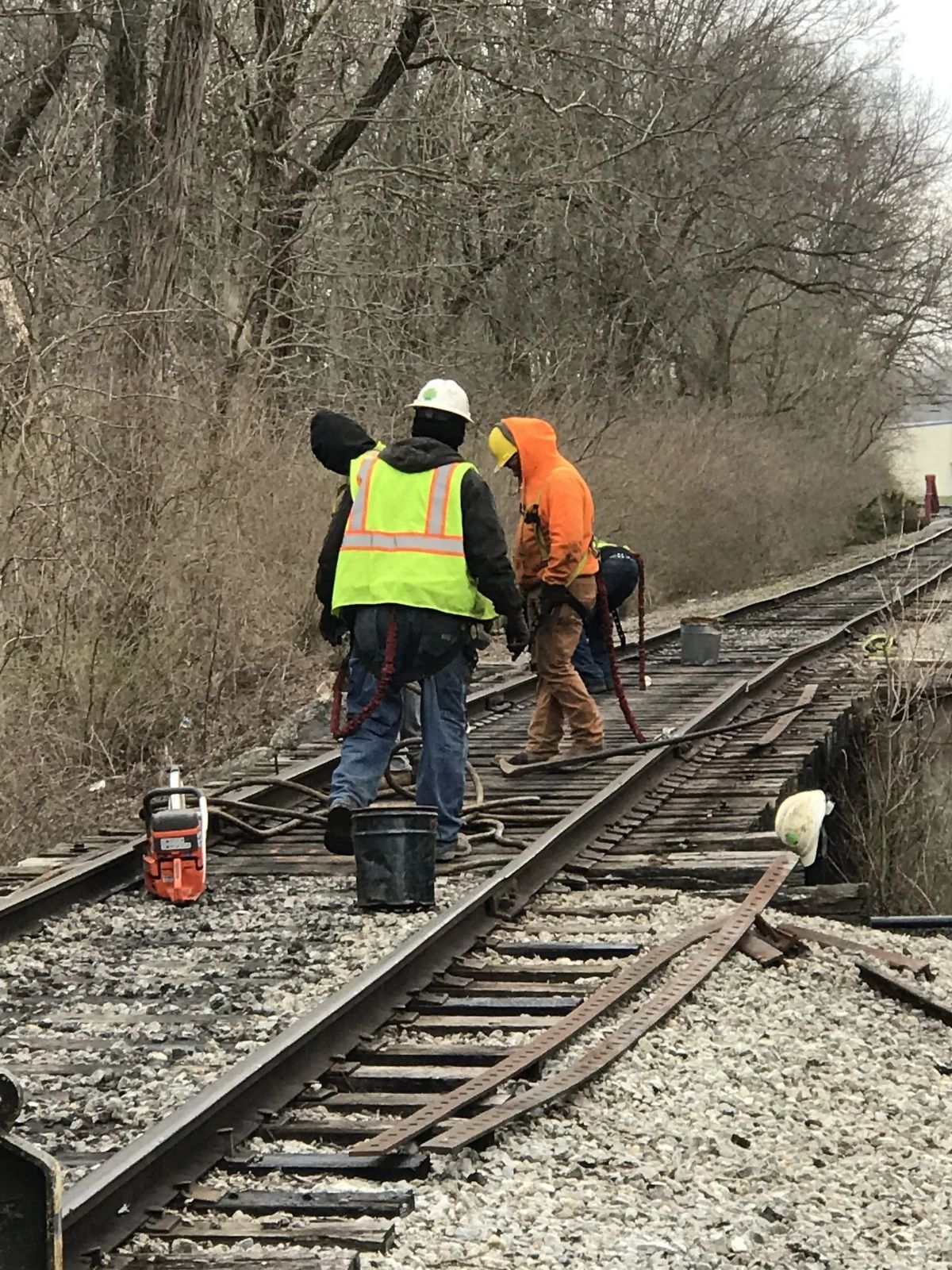 workers installing track scales