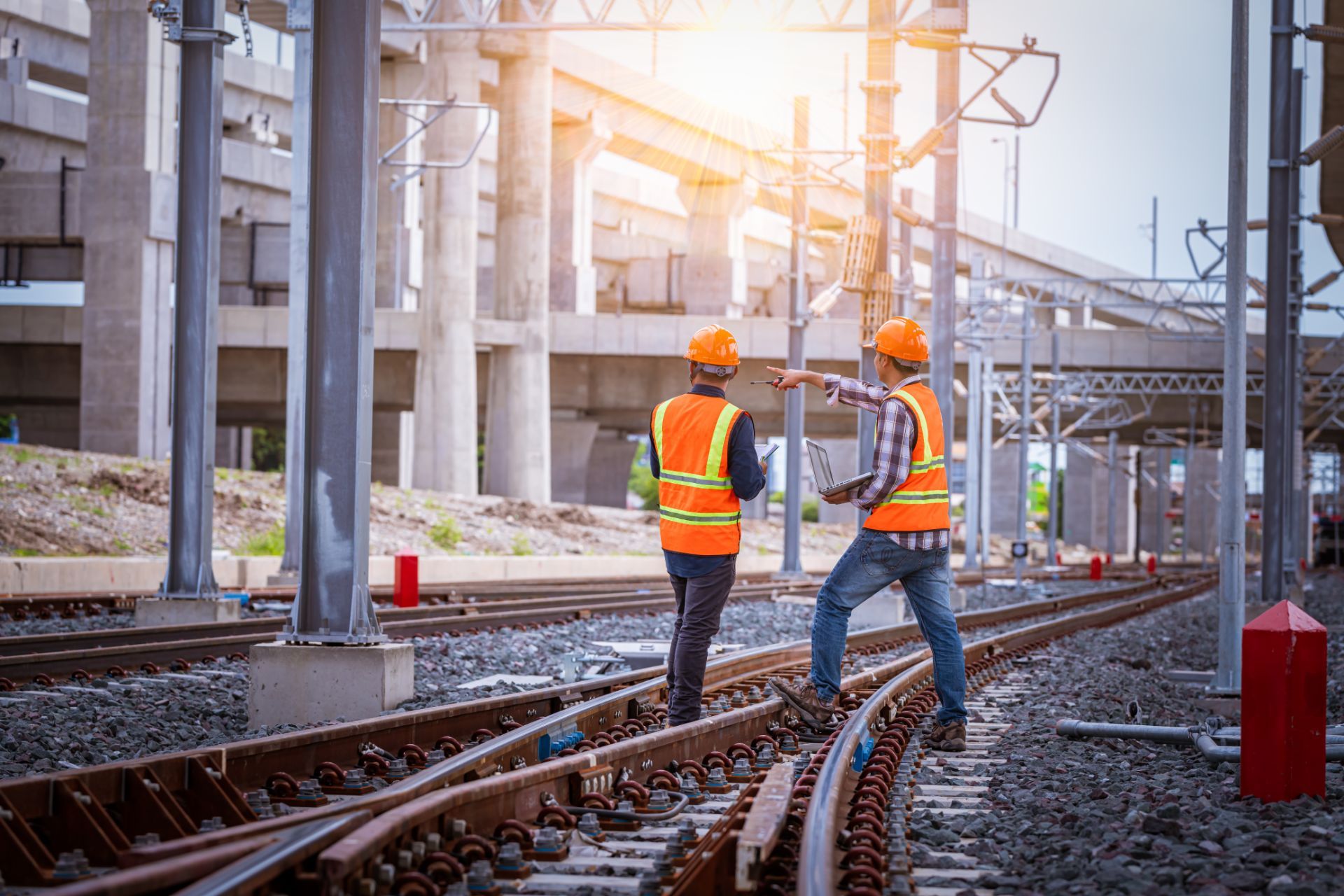 workers on track pointing away