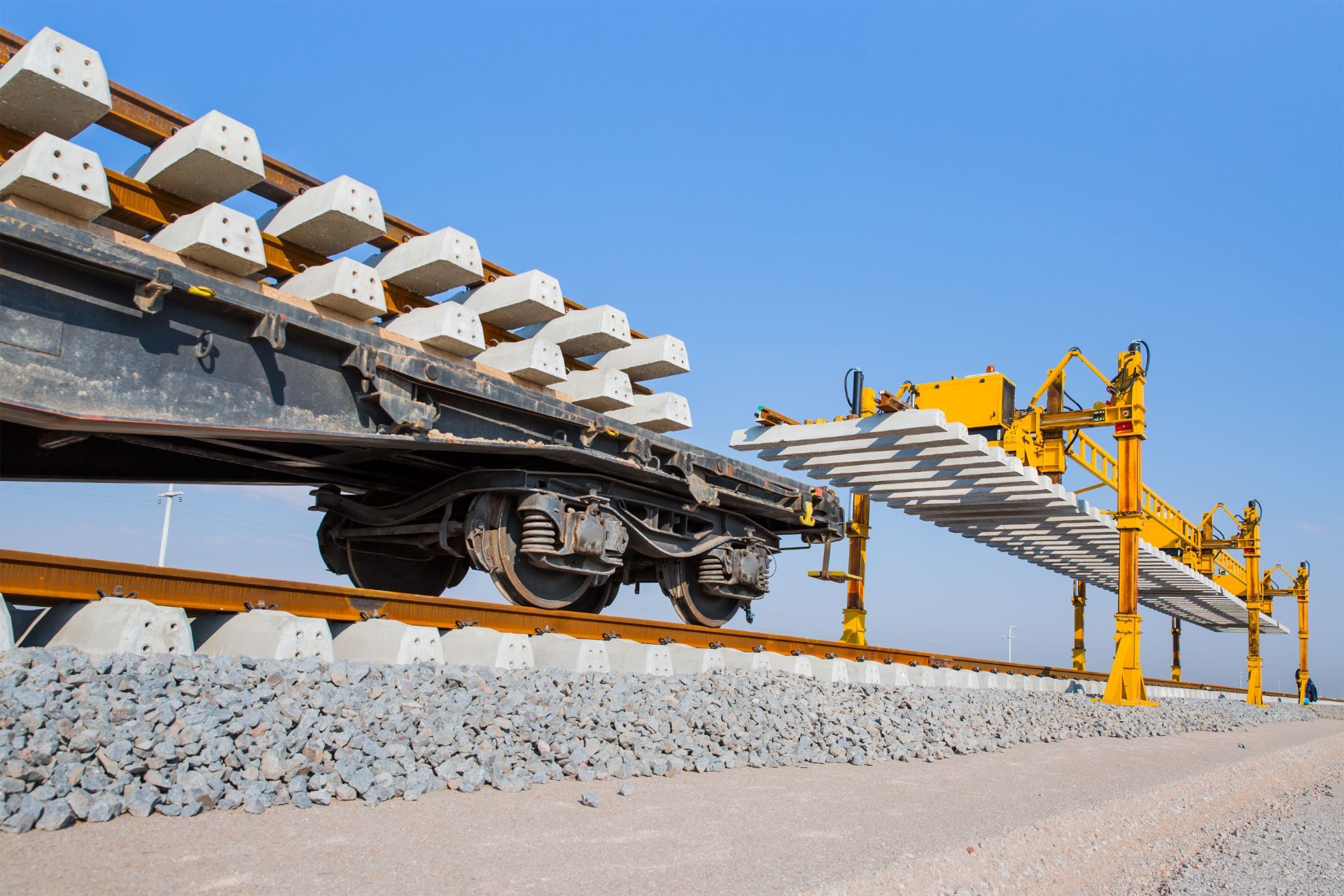 flatbed car carrying rails