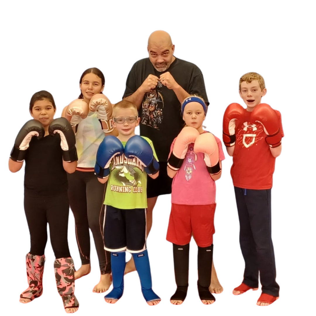 a group of children are practicing martial arts together .