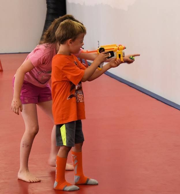 An aerial view of a city skyline at sunset.