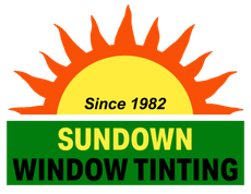 Logo for Sundown Window Tinting: Orange sunburst with 