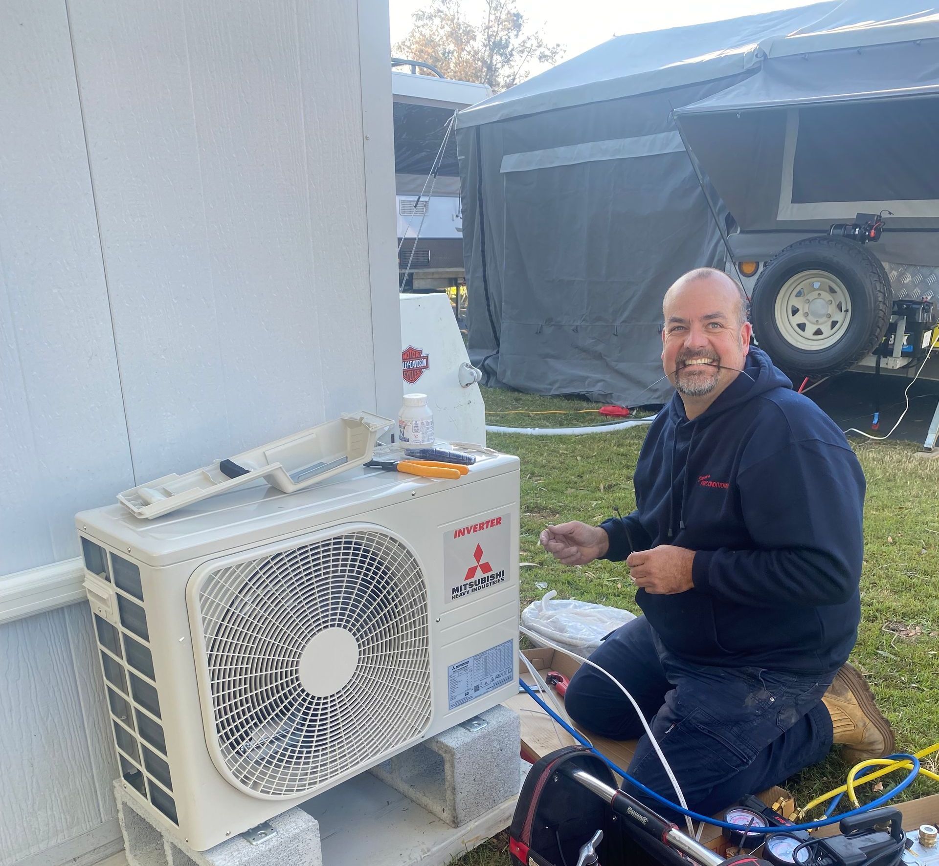 A Balcony With a Brick Wall and a Window With Blinds — Steve's Air Conditioning in Corrimal, NSW