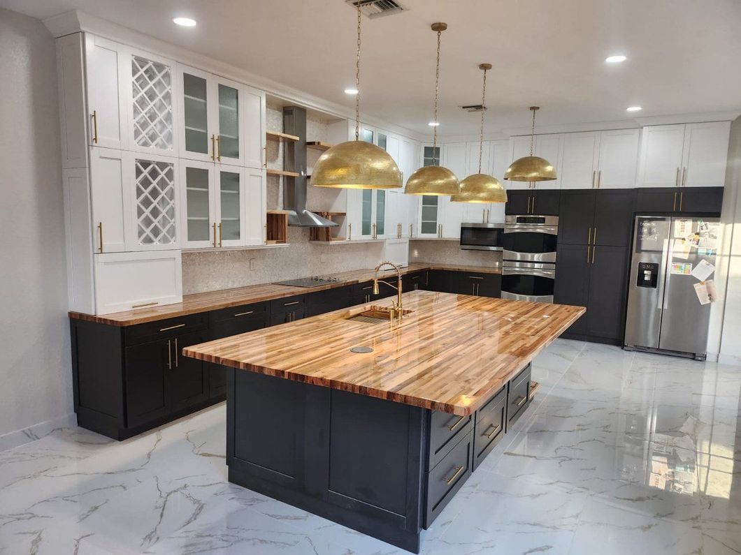 A kitchen with a large island in the middle of it.