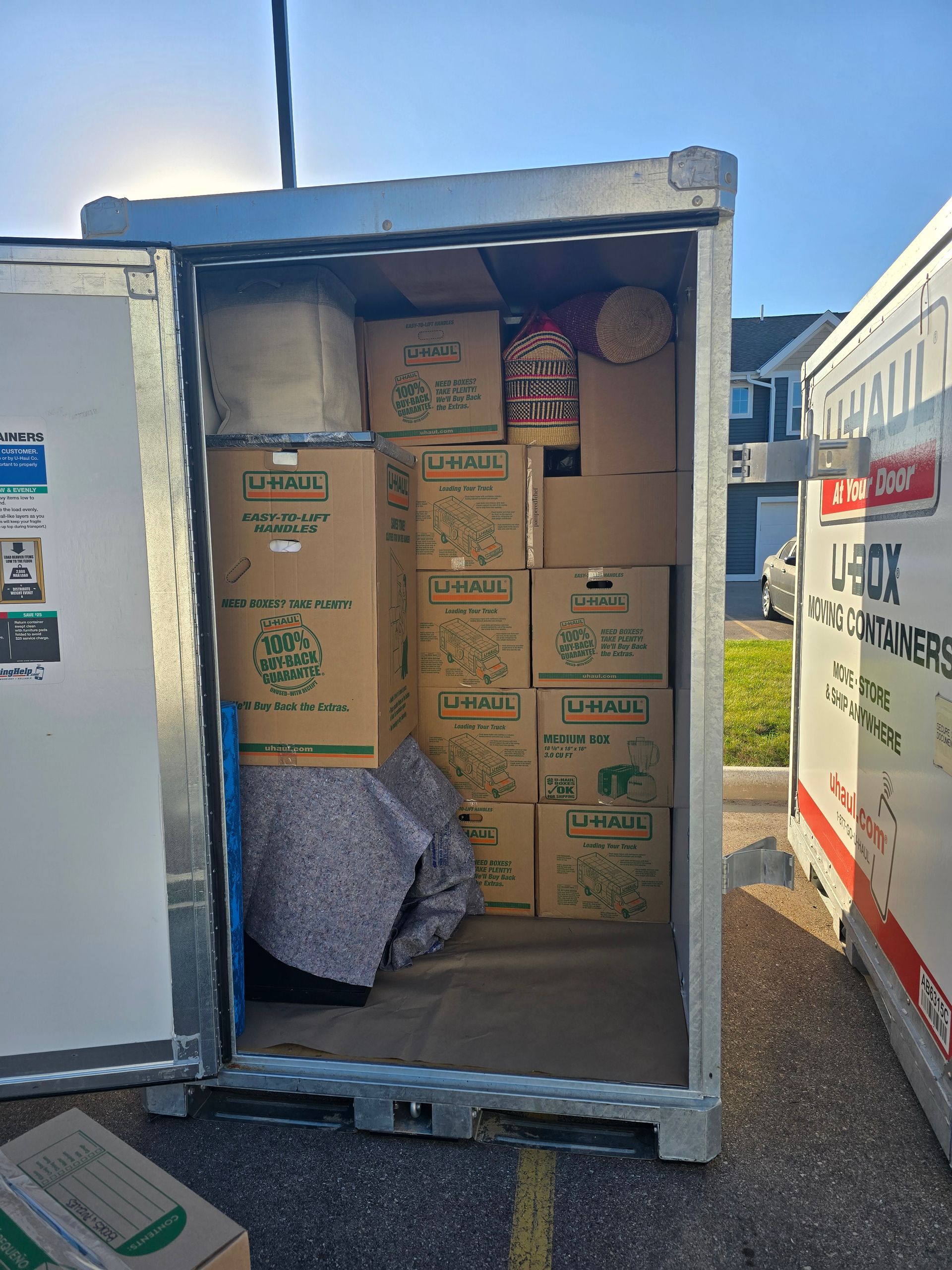 A container filled with lots of cardboard boxes.