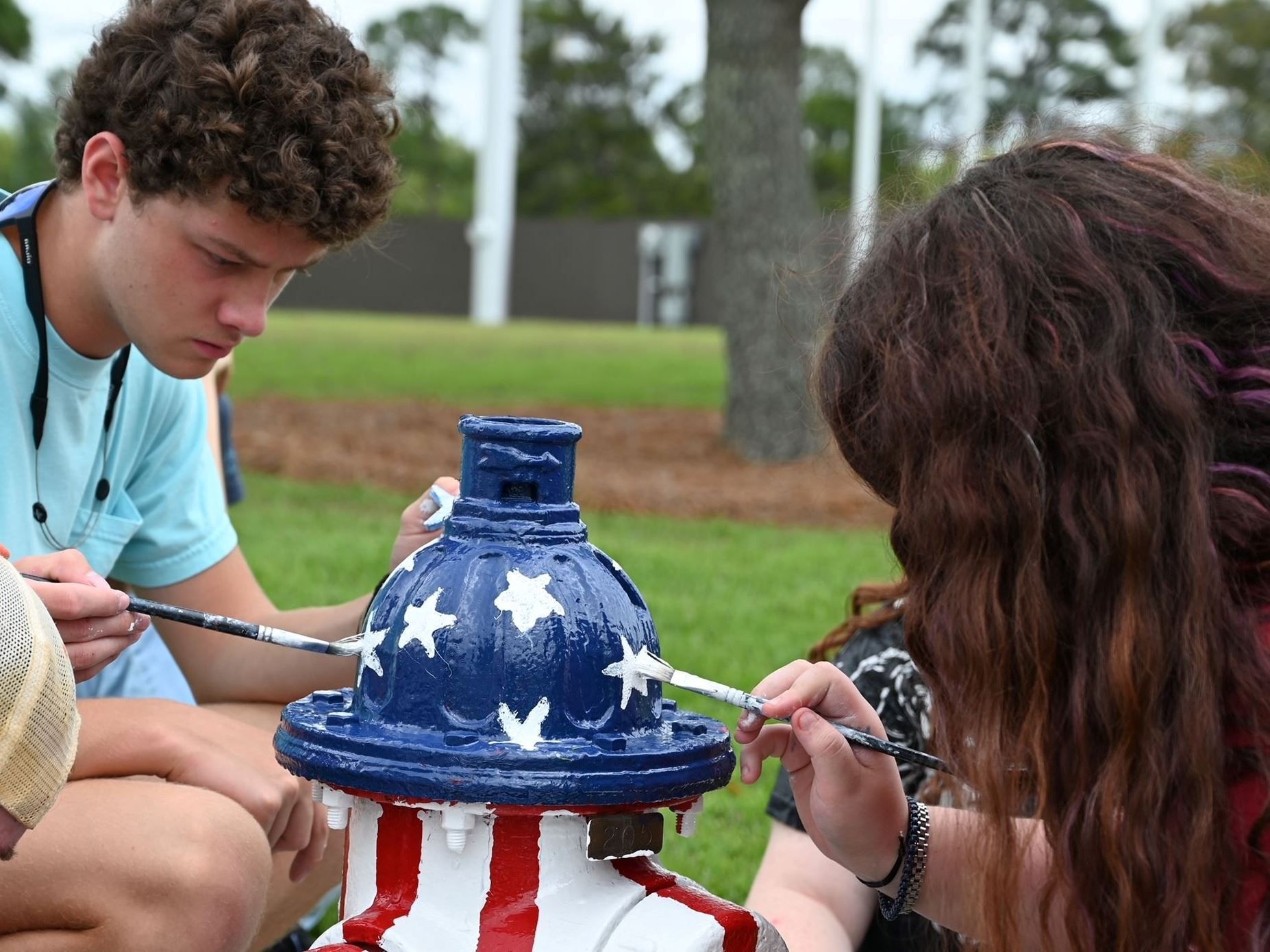 Students Paint Patriotic Fire Hydrants