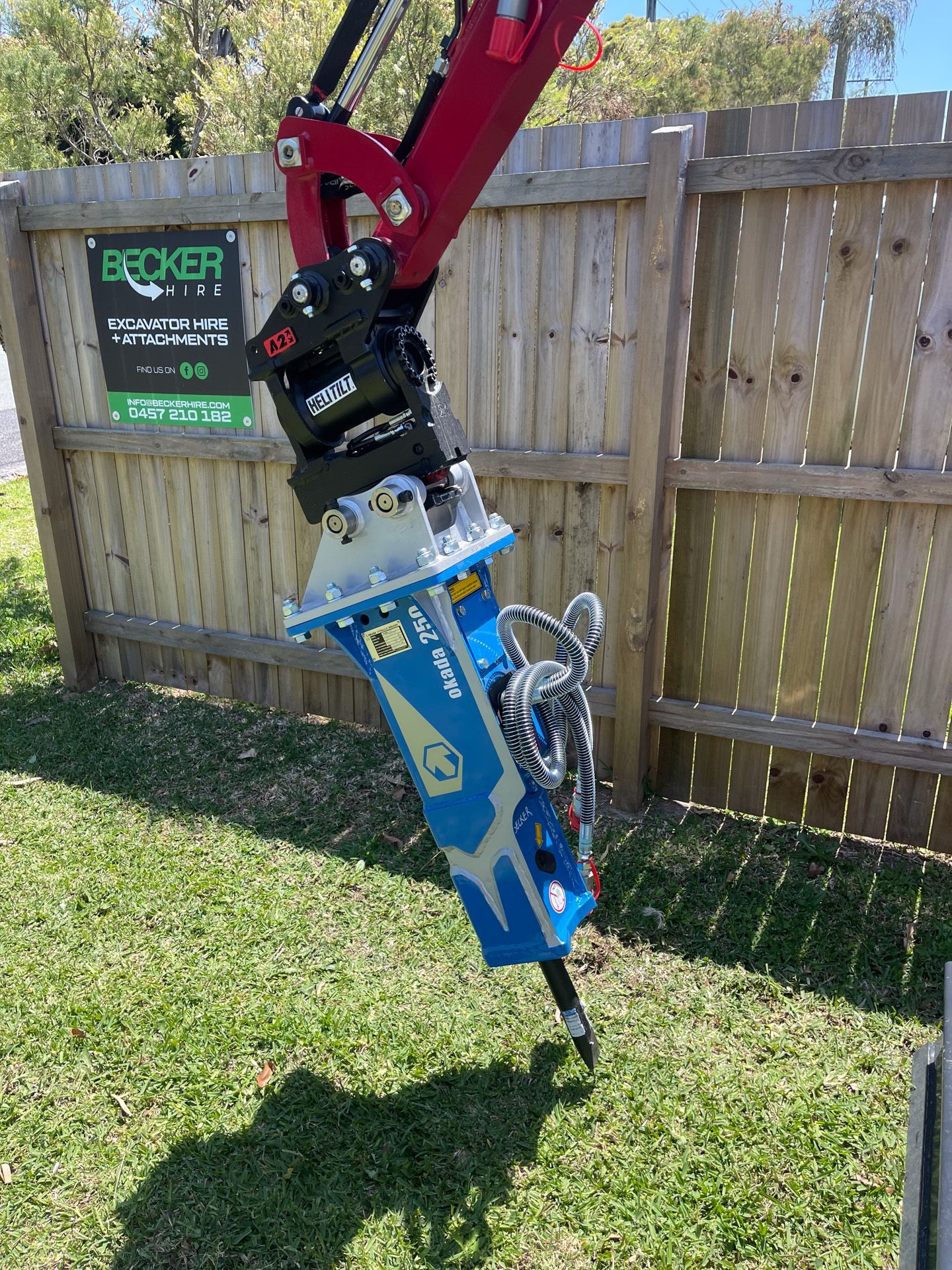 Close-up of tractor controls with a joystick, levers, and a rubber-covered knob.
