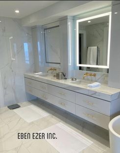 A bathroom with two sinks , a mirror and a bathtub.