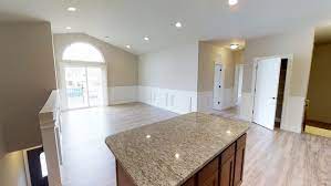 The Grand- Kitchen with granite countertop and appliances