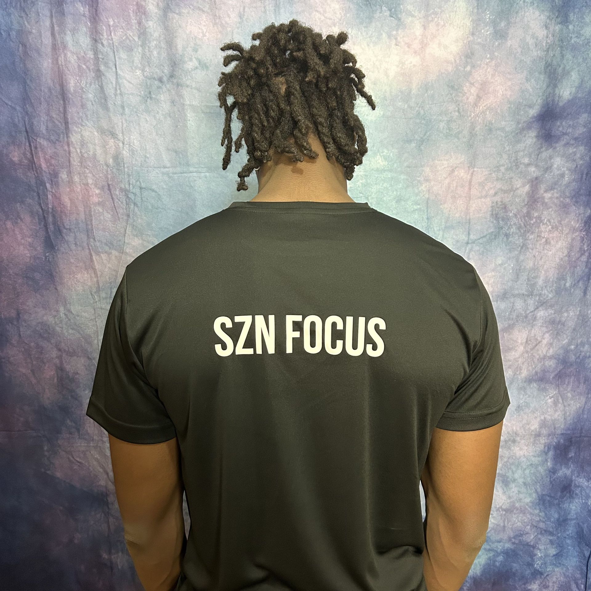 Black t-shirt with a white graphic of a lightbulb containing a target.