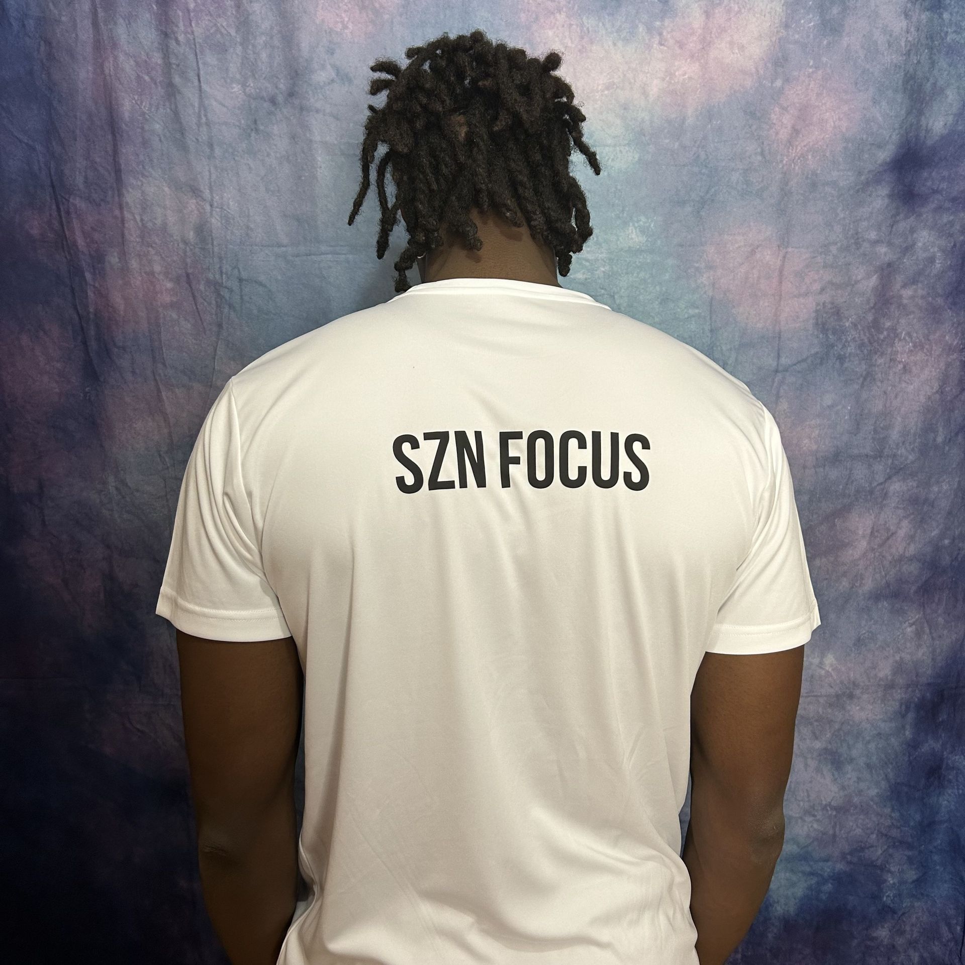 White t-shirt with black lightbulb graphic, the bulb containing a target.