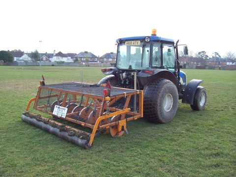cutting a sports pitch using a ride-on mower