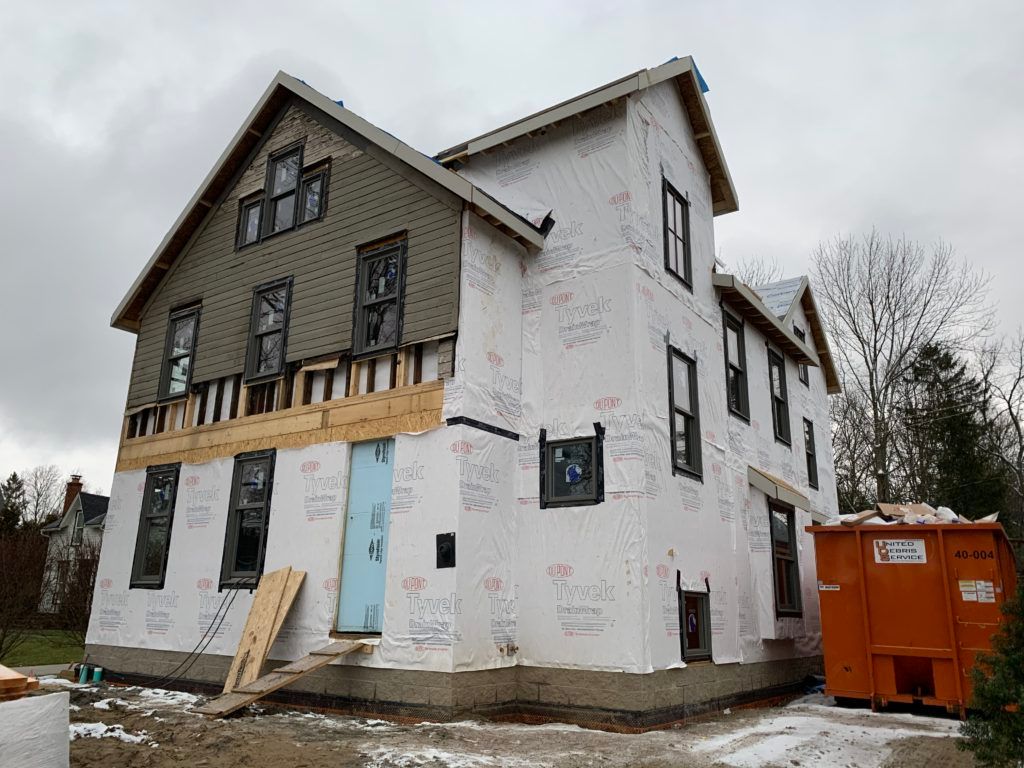 Hudson, Ohio home with siding being replaced by Hardie Board by James Hardie

