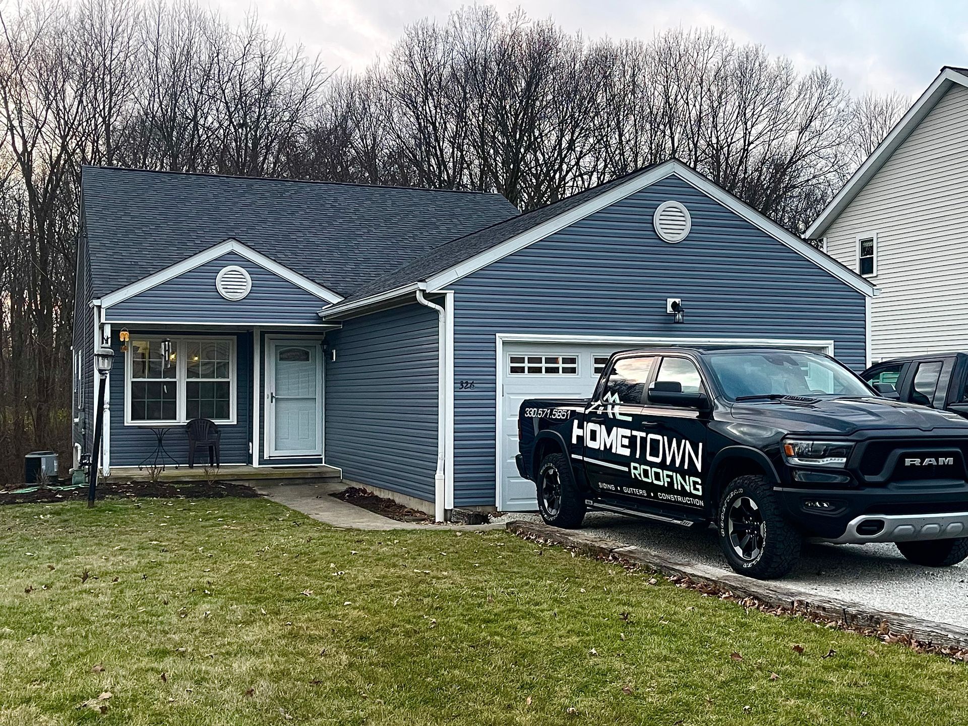 Our Vehicle Outside a Siding Project