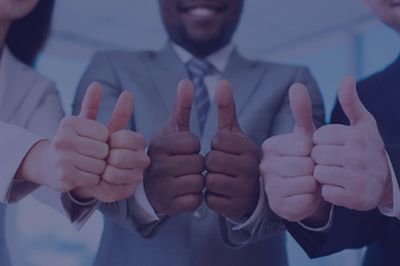 People in business suits giving thumbs up.