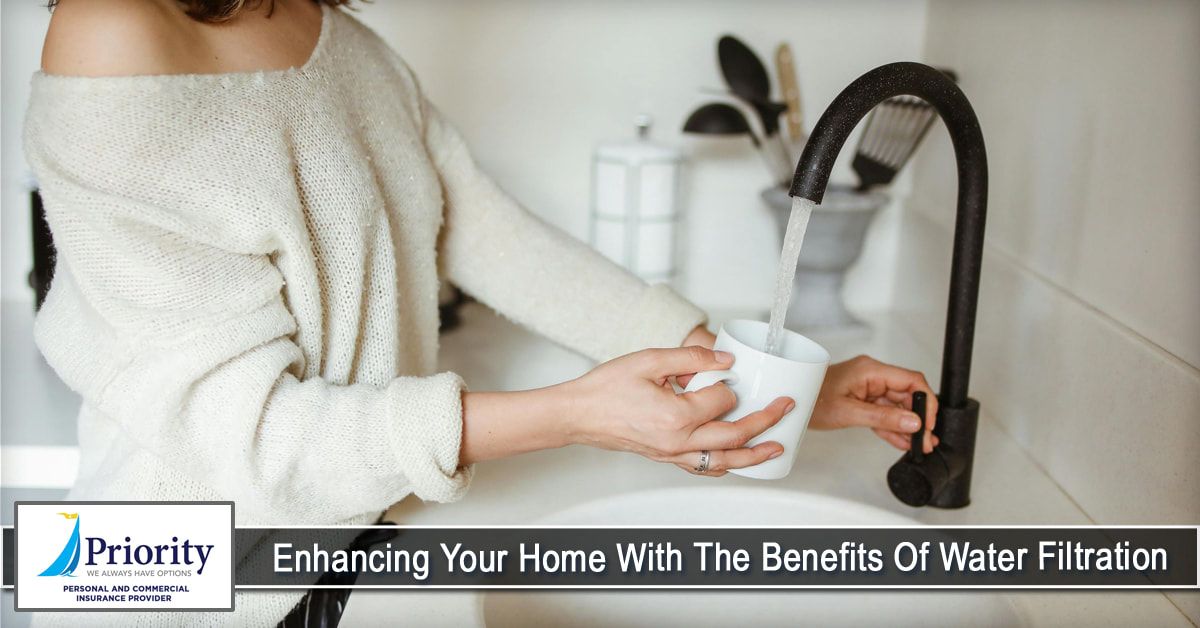 A woman is washing a cup of coffee in a sink.