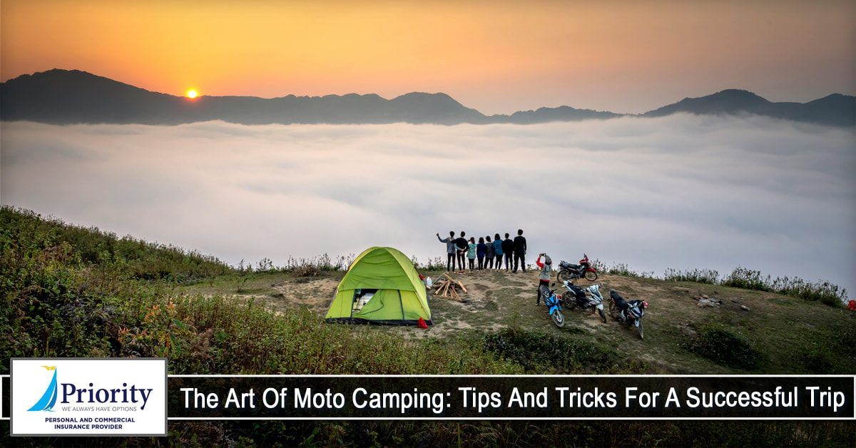 A group of people are camping on top of a mountain.