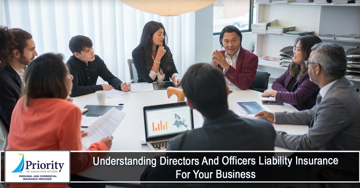 A group of people are sitting around a table having a meeting.