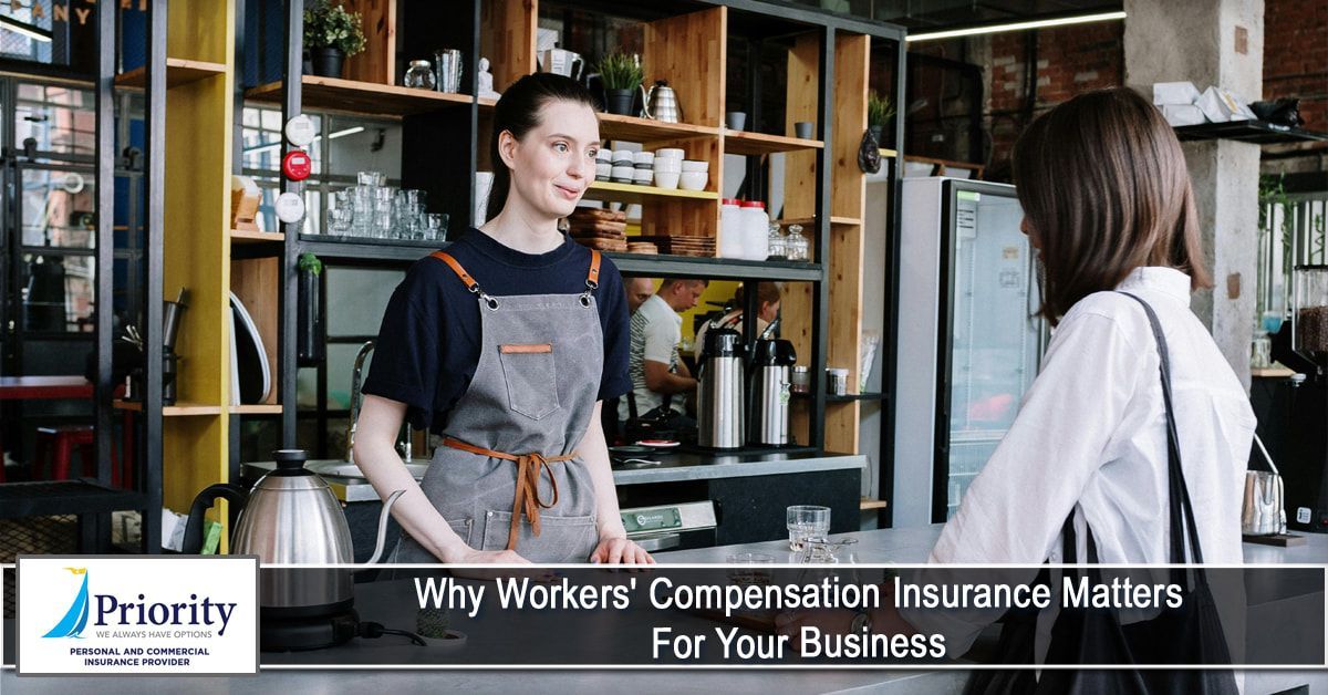 A woman in an apron is talking to another woman in a restaurant.