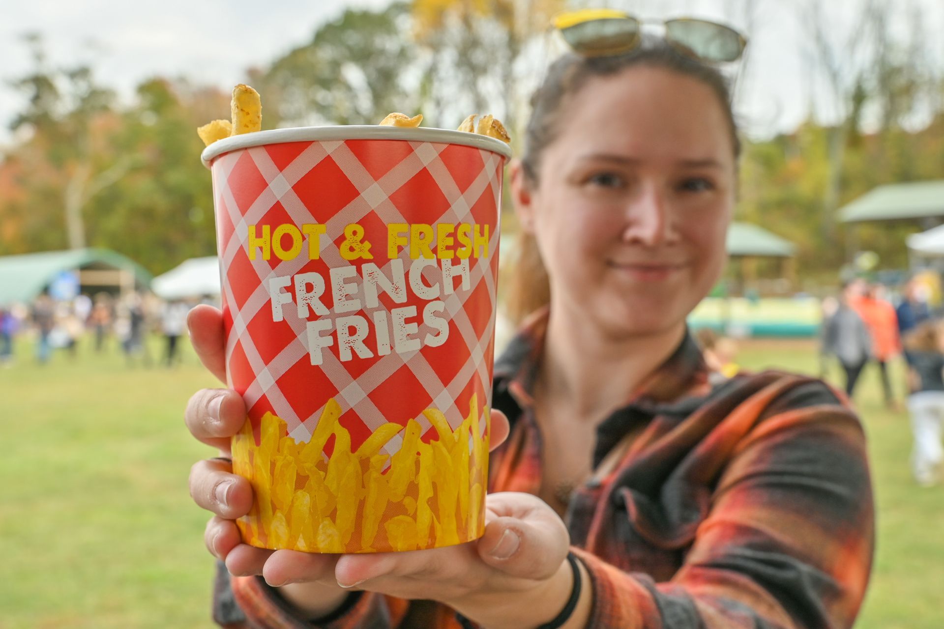 Woman holding a large cup of 