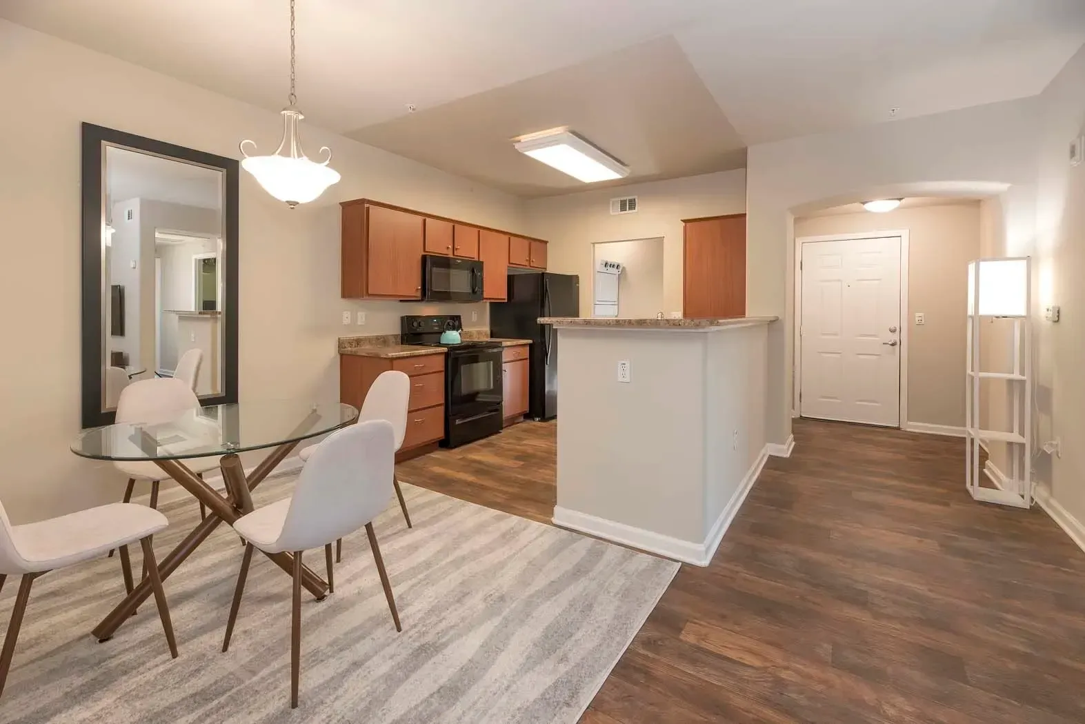 Modern apartment interior with dining area and kitchen