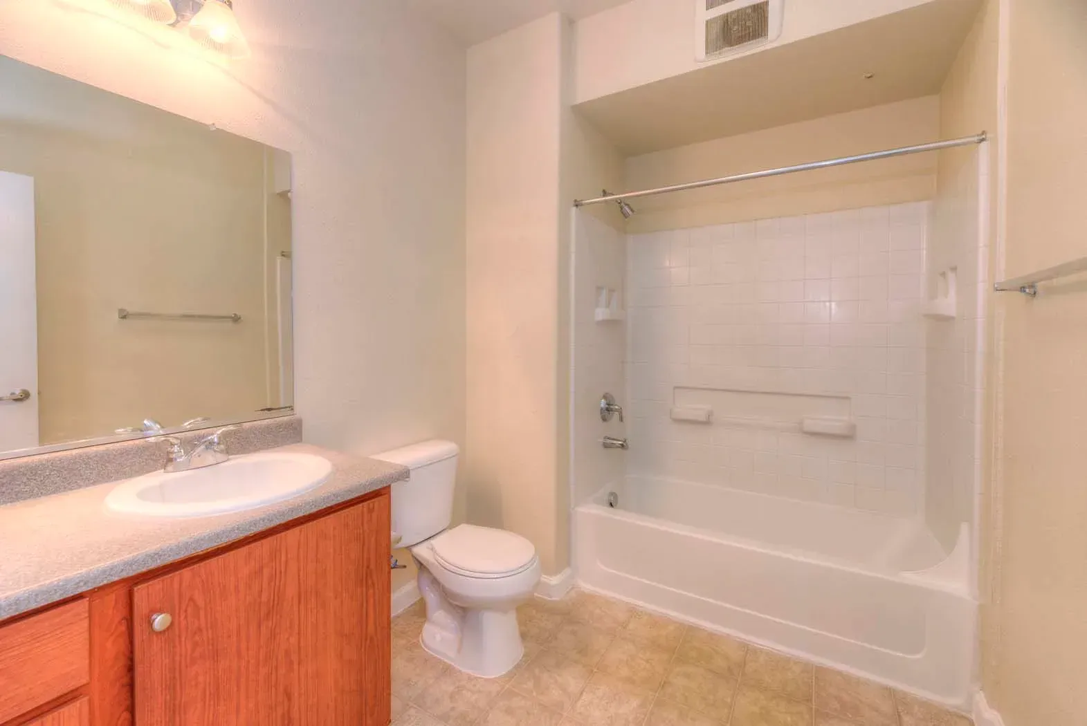 Spacious bathroom with sink, toilet, and shower