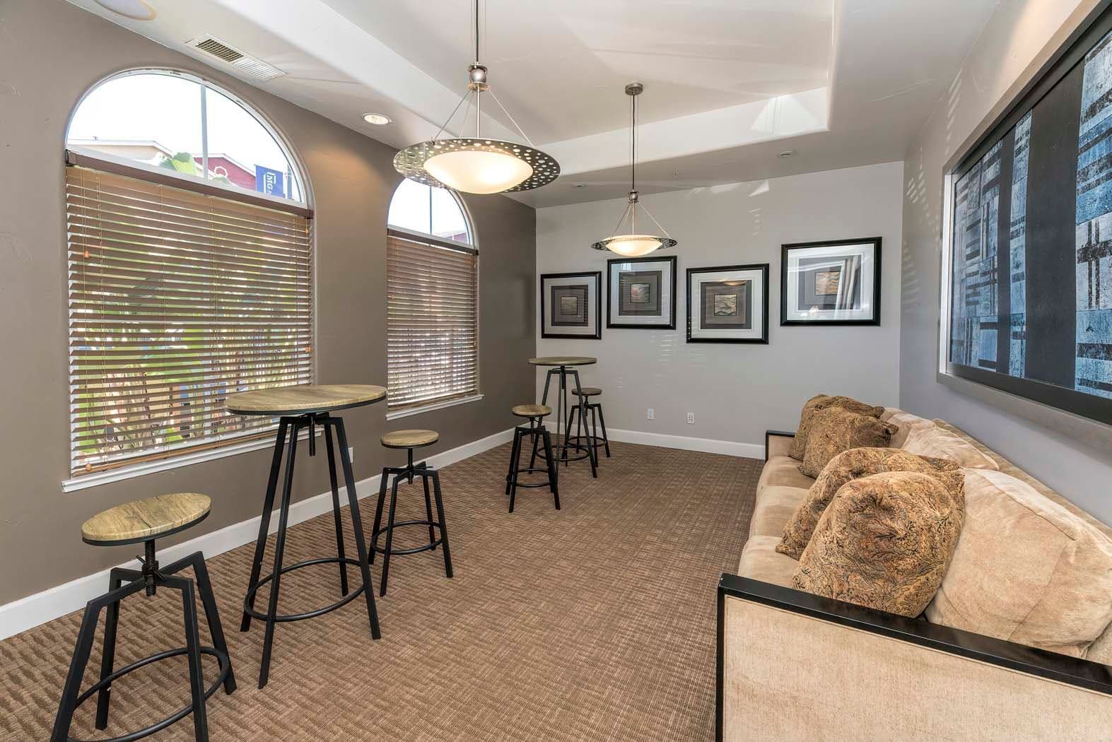 Common lounge area with tall tables and seating