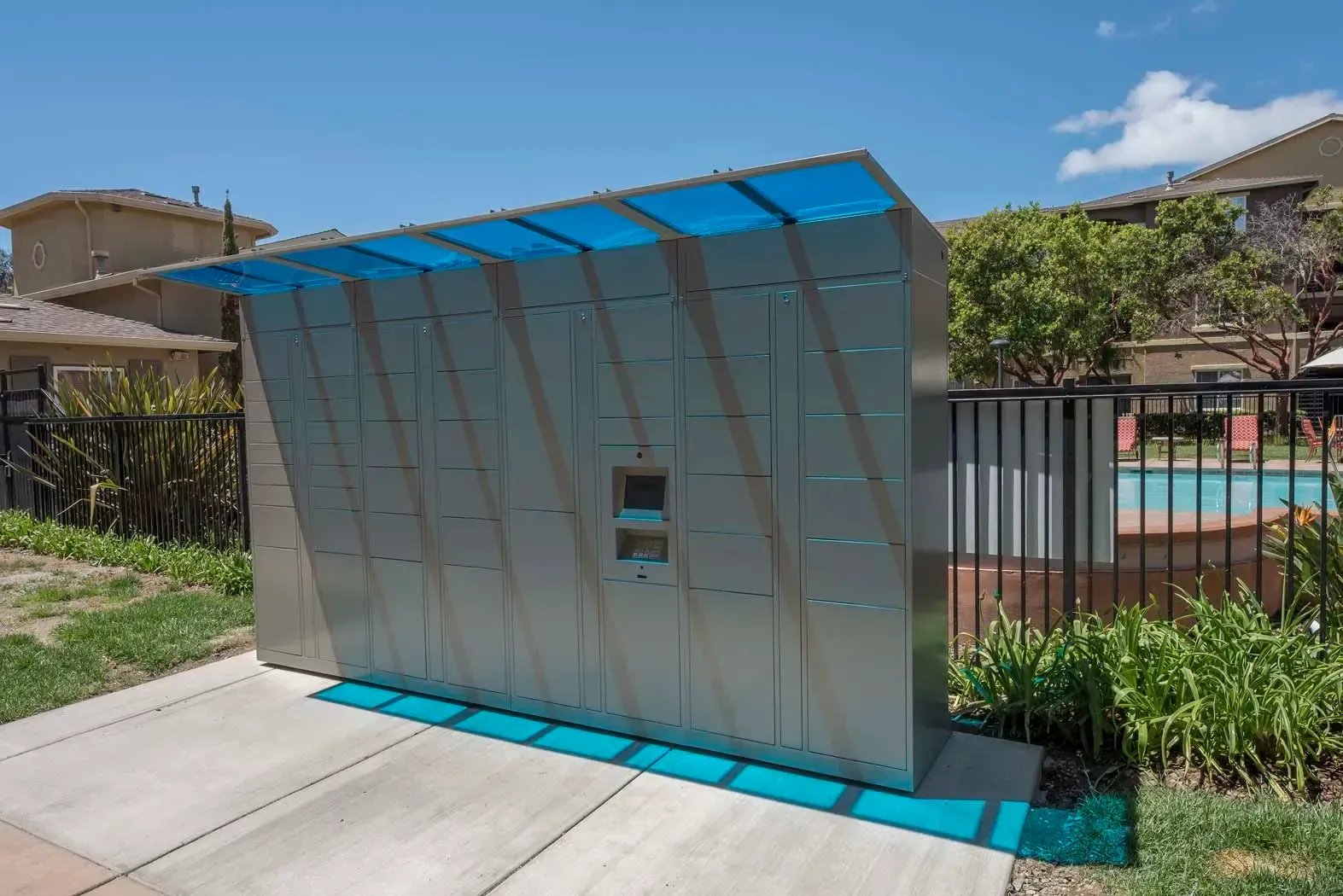 Outdoor package mailbox station near a pool