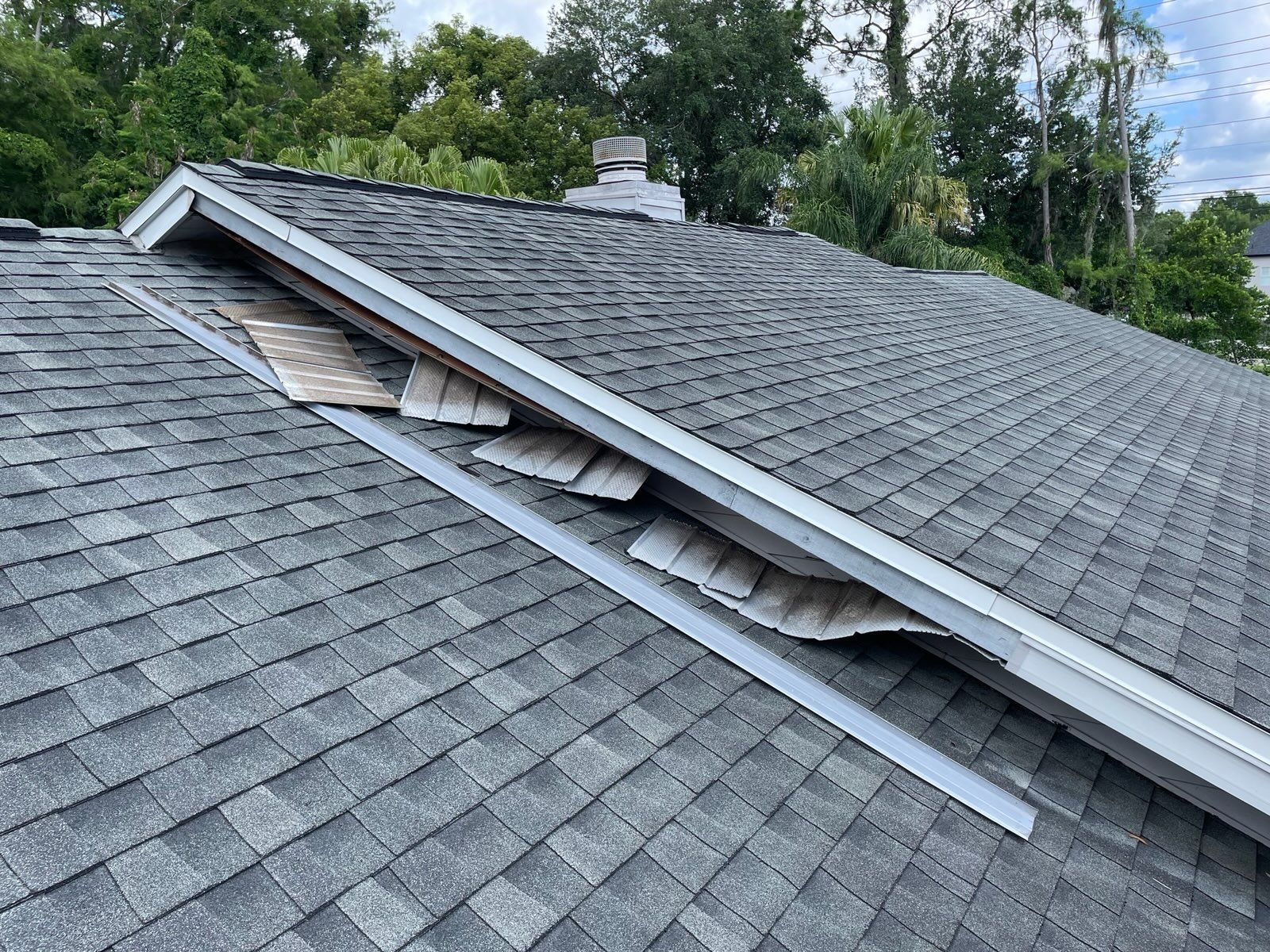 A close up of a roof with a hole in it.