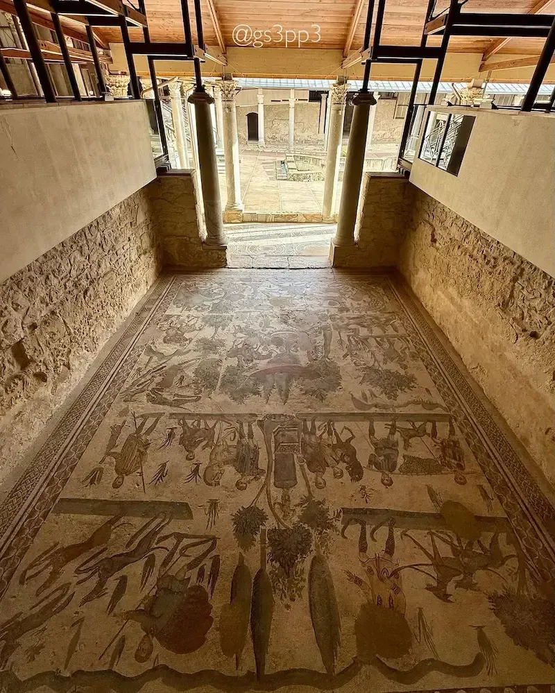 Interior corridor of Villa Romana del Casale in Piazza Armerina with ancient stone walls and wooden ceiling