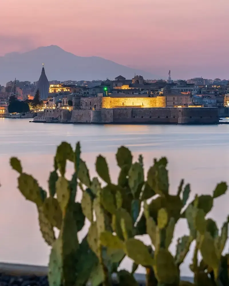 Waterfront view of Castello Maniace in Siracusa at sunset